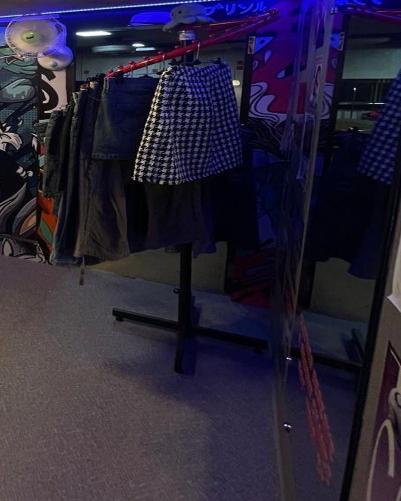 Rail of vintage denim and checks